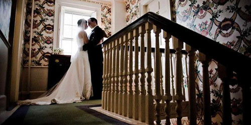 Wedding Top of Stairs 500x250 - Harbor Light Inn - Marblehead, MA - Photo Credit Melissa Coe