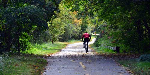 Fall Foliage in Massachusetts - Cyclists on the Minuteman Bikeway in Lincoln/Lexington/Concord MA - Photo Credit MOTT